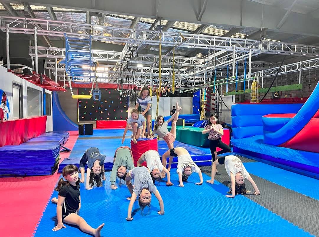 Kids training on the obstacle course floor